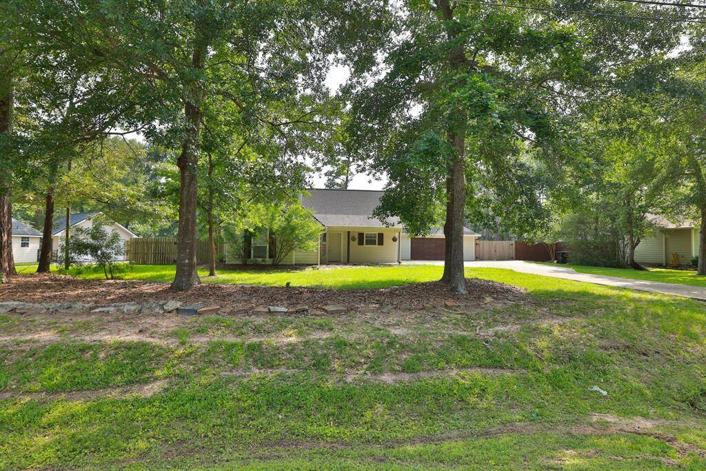 Surrounded by mature trees, this house offers a serene setting with a lush front lawn and ample privacy. Ideal for those seeking a peaceful, nature-infused environment.