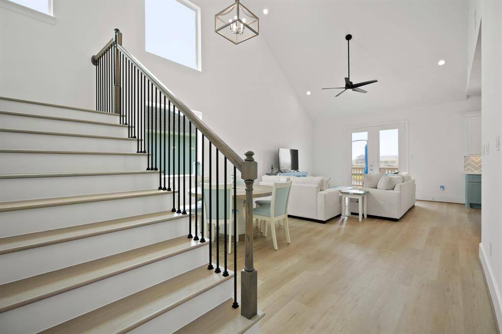 View of livingroom and stairs that lead to the Owner's Suite
