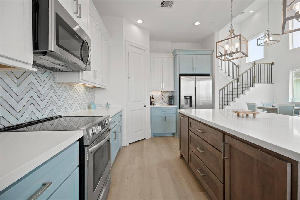 Beautiful soft close cabinets in a soft blue
