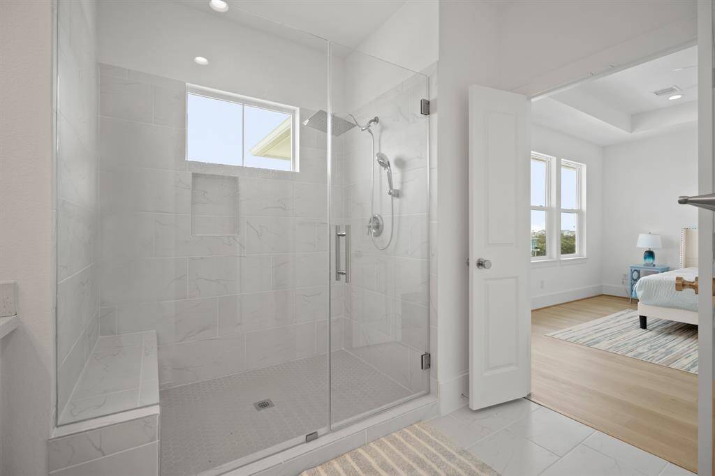 HUGE shower with rain shower head and bench