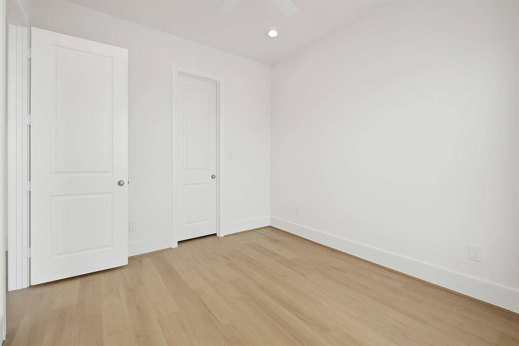 1 of 2 guest bedrooms with walk-in closet