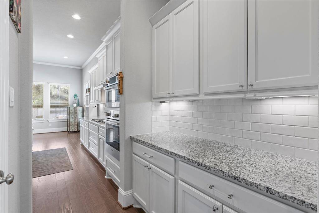 Butler's pantry located between the formal dining room and kitchen