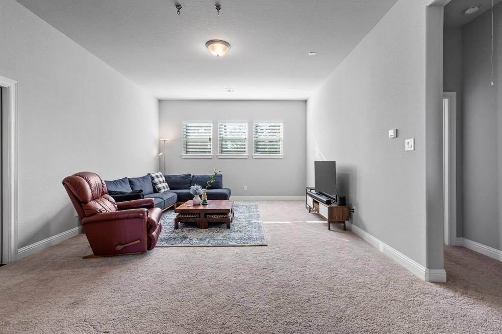 Upstairs, discover a spacious game room, three additional bedrooms, three full baths, and a large Texas basement providing ample storage for your needs.
