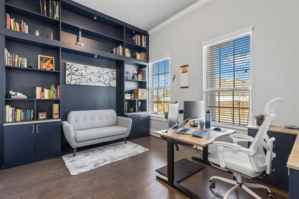 Study features a custom built-in and gleaming wood floors, tailored to your needs and preferences