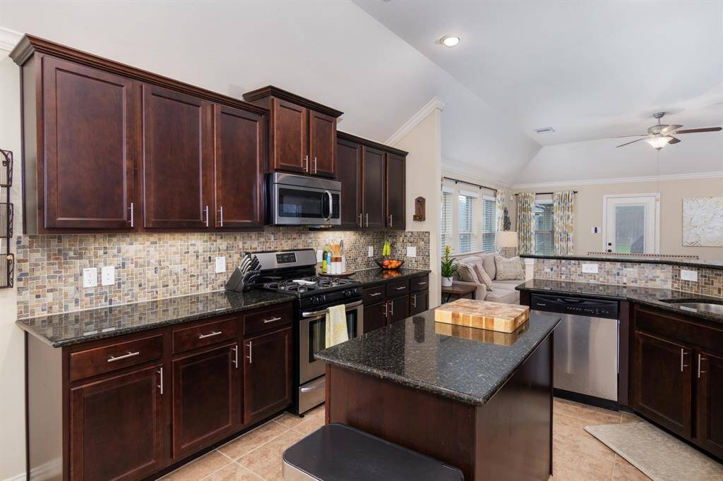 Island kitchen with stainless appliances