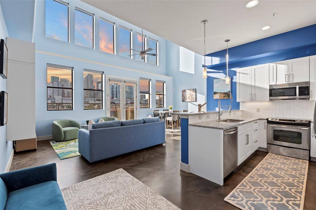 Welcome to No. 302. Living area drenched in natural sunlight. and blue hues inside and out.