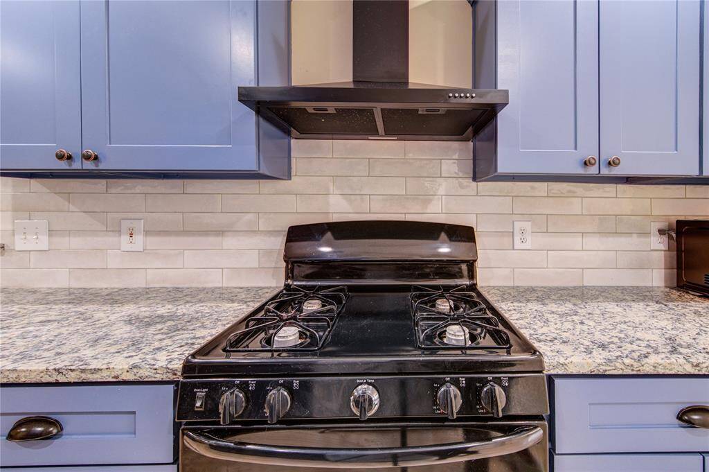 Kitchen with gas range.