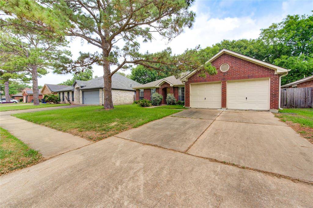 Double-wide driveway and 2 car garage.