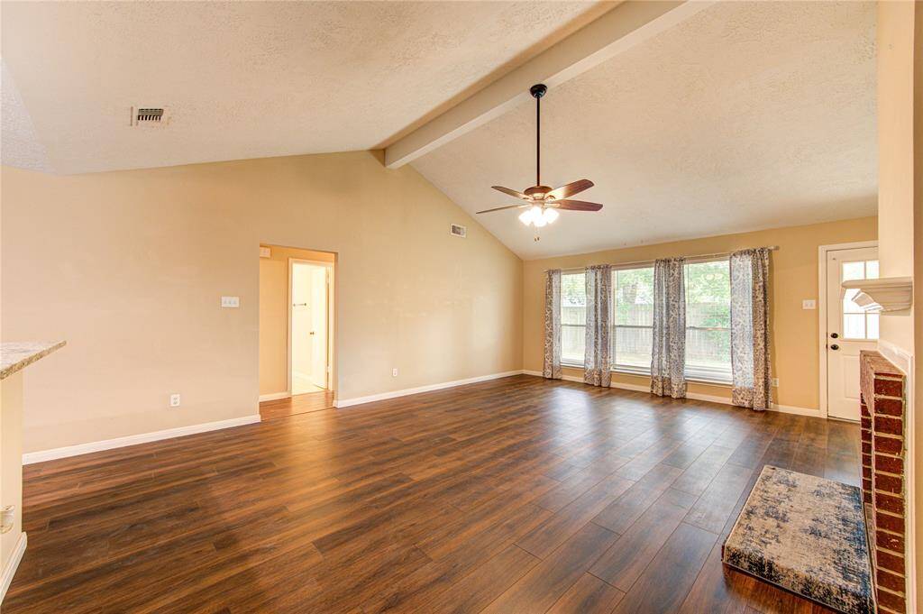 Another view of the family room with ample natural light.