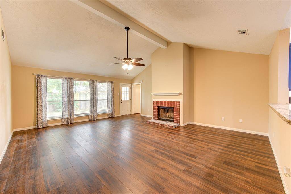 Family room with entrance to the primary (center) and patio door (center-left).