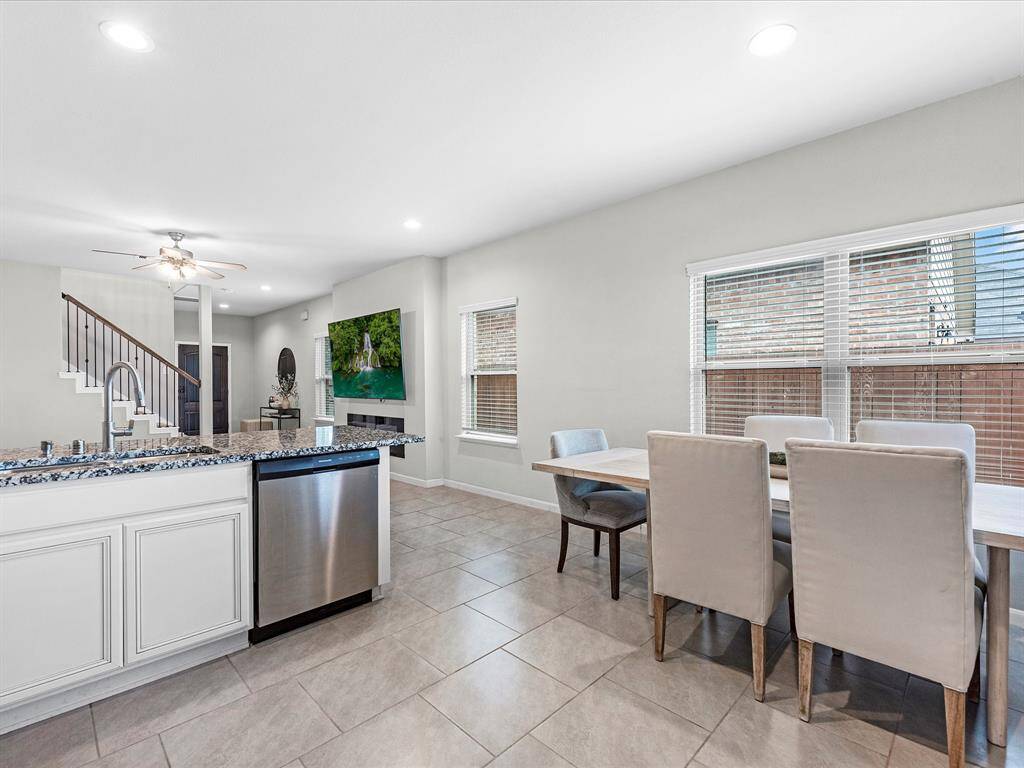 Amazing kitchen featuring granite counter tops, gas stove, fridge included, and tons of seating space