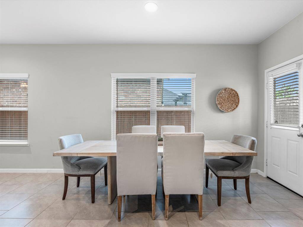 Amazing kitchen featuring granite counter tops, gas stove, fridge included, and tons of seating space.