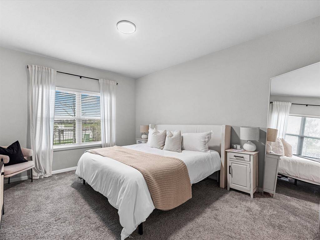Oversized primary bedroom located on the first floor, with great natural light flowing through.