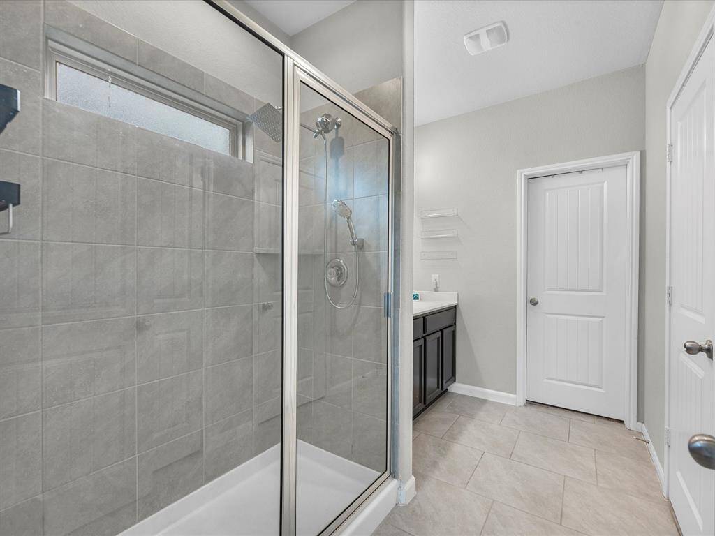 Primary bathroom features a stand up shower, dual sinks, walk in closet, private toilet, and so much more.