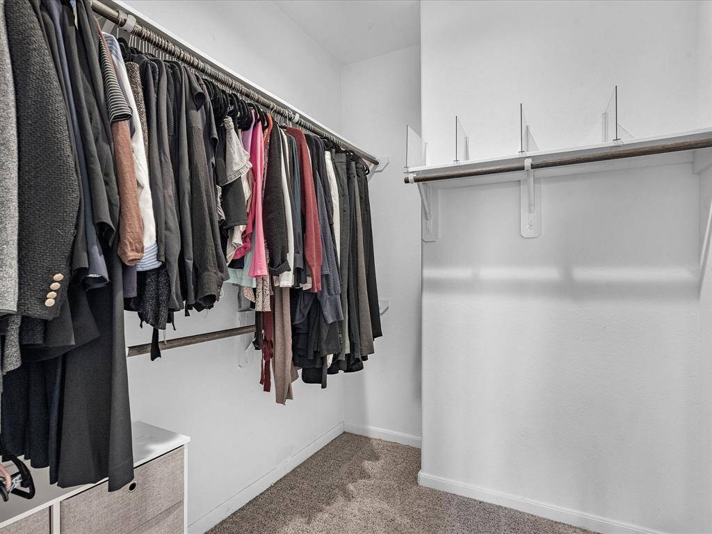 Primary bathroom features a stand up shower, dual sinks, walk in closet, private toilet, and so much more.