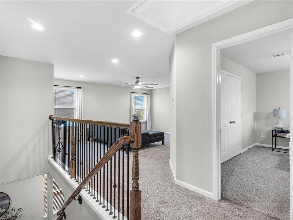 The second-floor features a media/flex space, perfect for movie or game nights.
