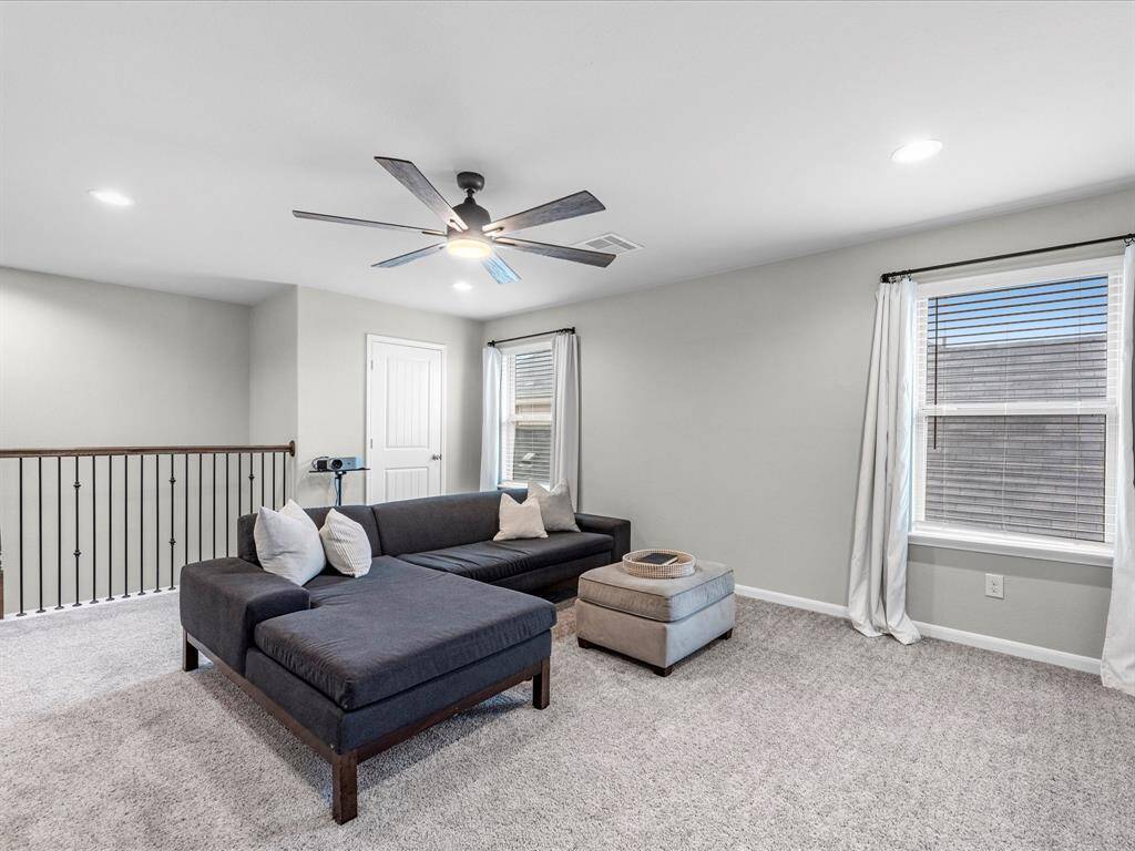 The second-floor features a media/flex space, perfect for movie or game nights.