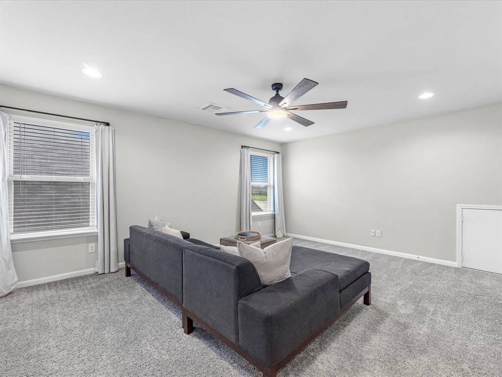 The second-floor features a media/flex space, perfect for movie or game nights.