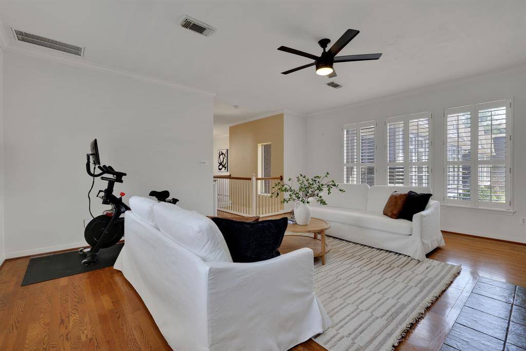 The living space that highlights the expansive windows bringing in natural light and lush outdoor views