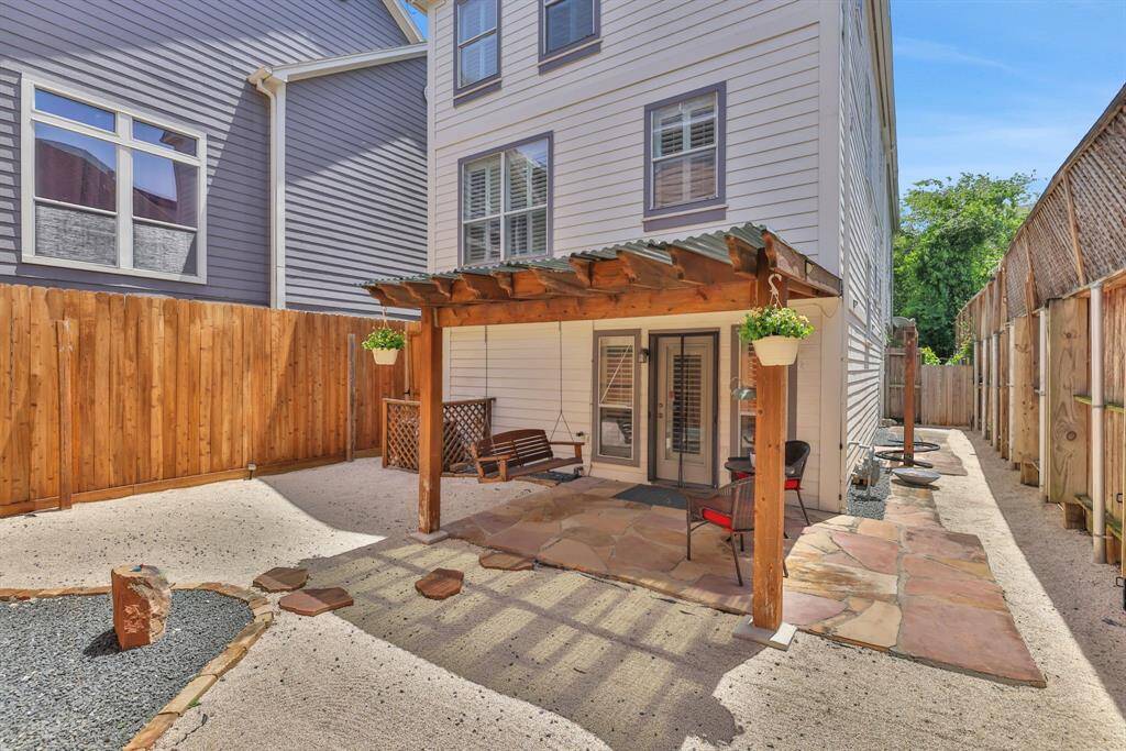 Your private outdoor escape—this backyard features a stylish pergola and inviting lounge area perfect for entertaining