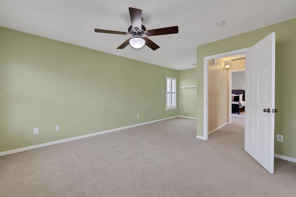 A broader perspective of the secondary bedroom showcases space and layout flexibility
