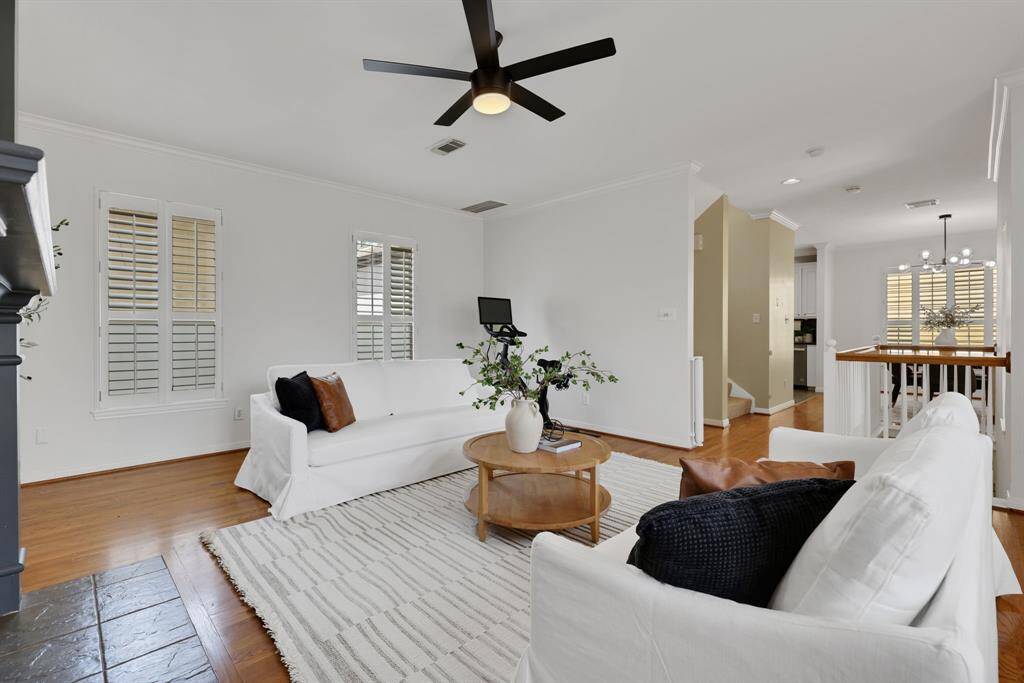 This open-concept layout seamlessly connects the living room to the kitchen and dining area—perfect for entertaining or relaxed living