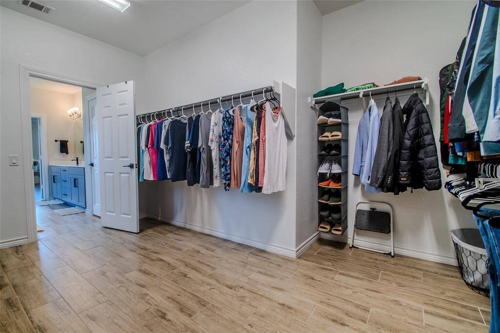 Primary walk-in closet 15x9