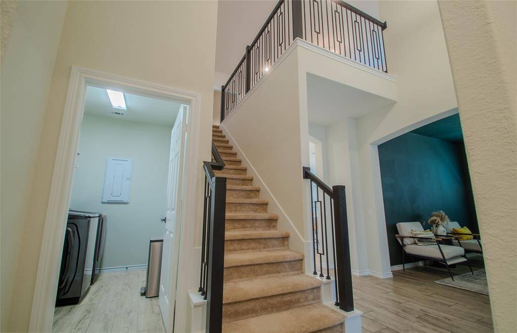 Laundry room, staircase, and office view
