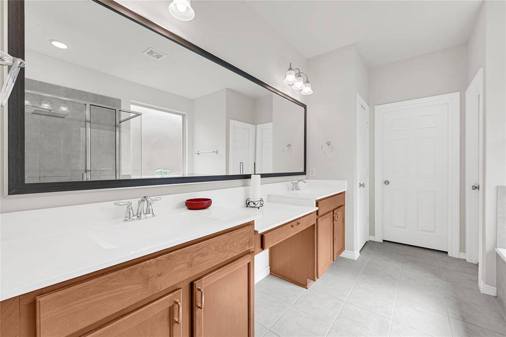 Spa-Like Primary Bath – Dual sinks, a luxurious rainfall shower, and a spacious soaking tub