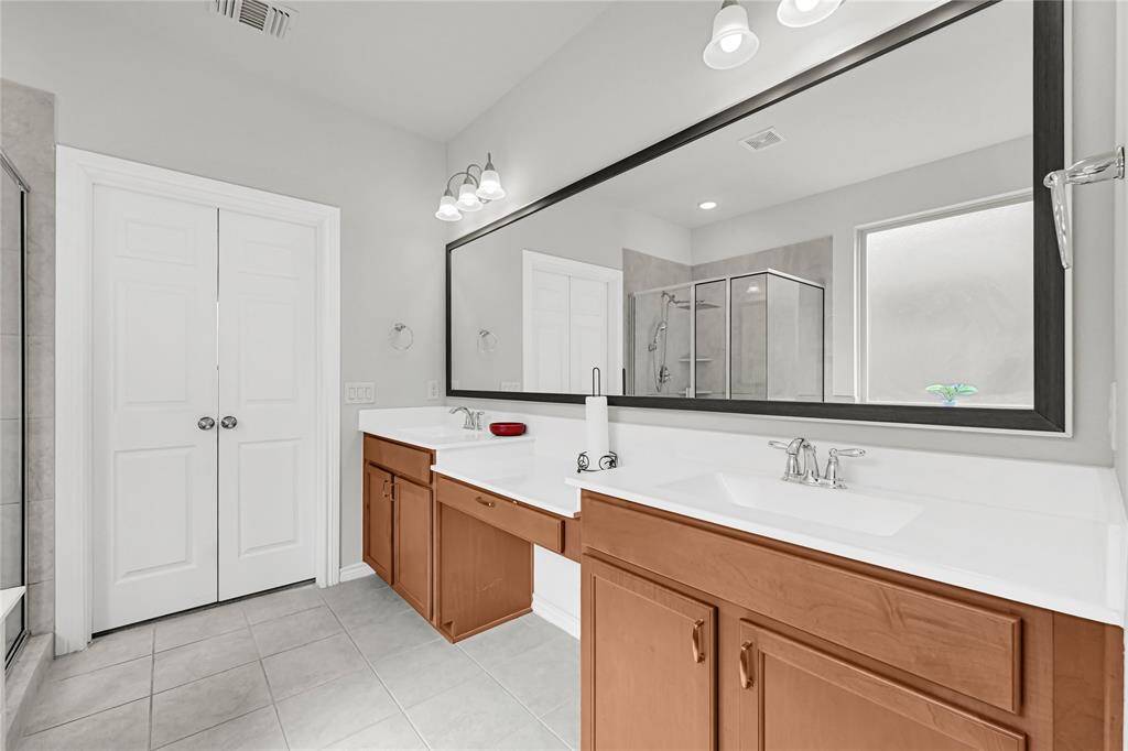 Spa-Like Primary Bath – Dual sinks, a luxurious rainfall shower, and a spacious soaking tub
