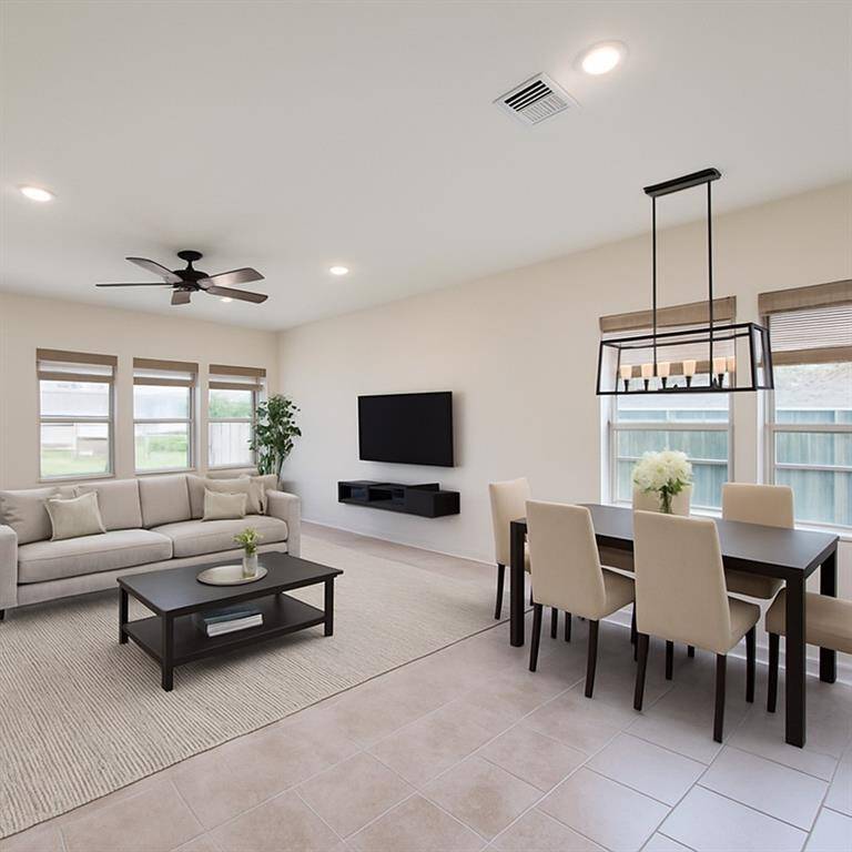 Spacious Family & Dining Combo – Open and inviting, with light-colored tiles and abundant natural light from large windows