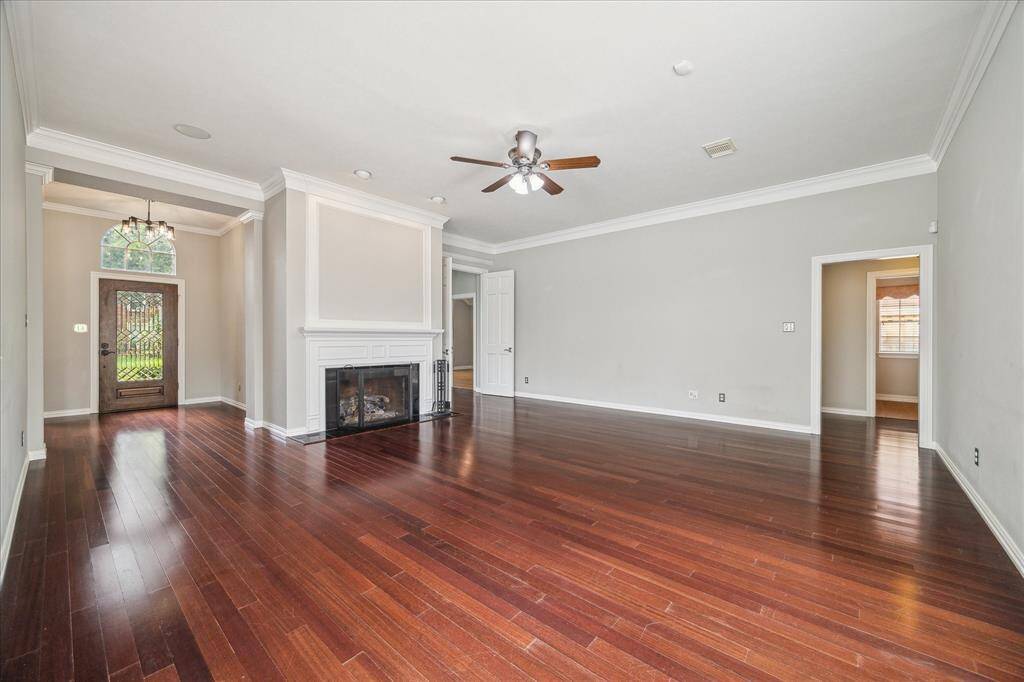 From the living room, enjoy a full view of the graceful entry, showcasing the home’s refined architectural details and thoughtful layout.