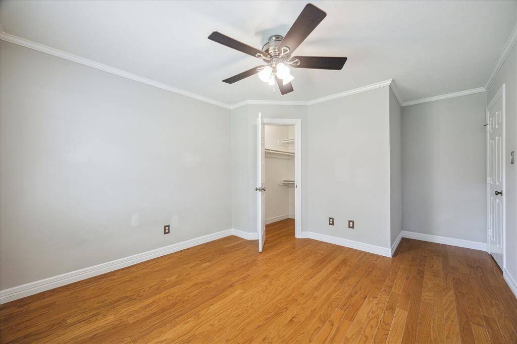 With its own walk-in closet, this corner bedroom maximizes space while maintaining a clean and airy feel.