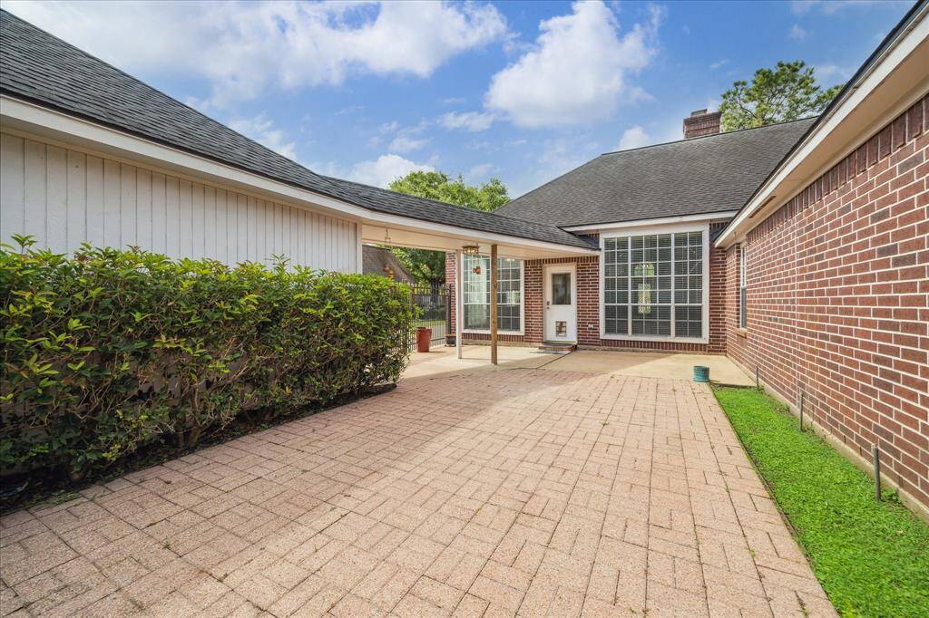 The generous brick-paved patio provides a low-maintenance area for relaxing or entertaining outdoors.
