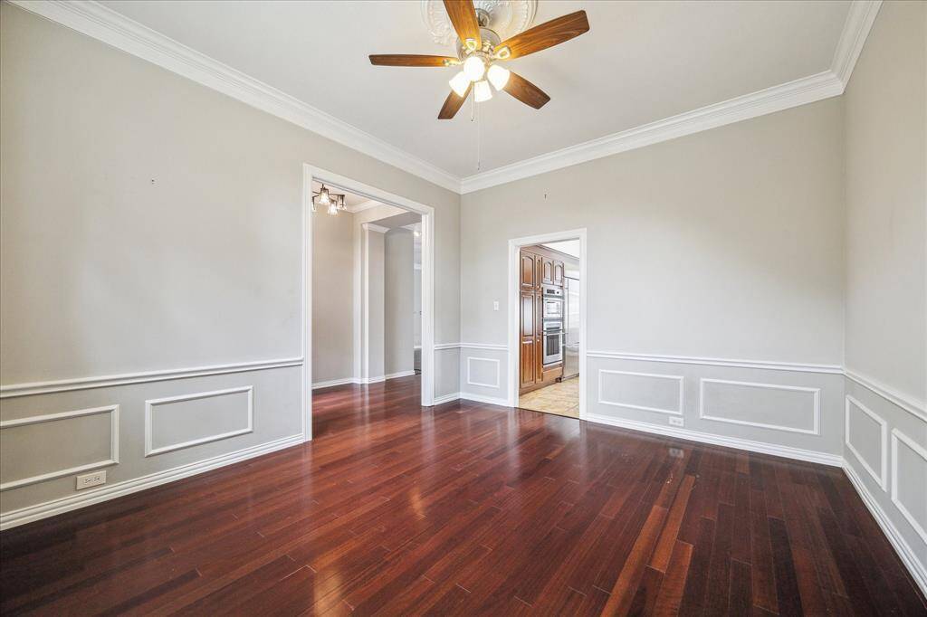 The formal dining room connects seamlessly to the kitchen, offering the perfect setup for effortless entertaining.