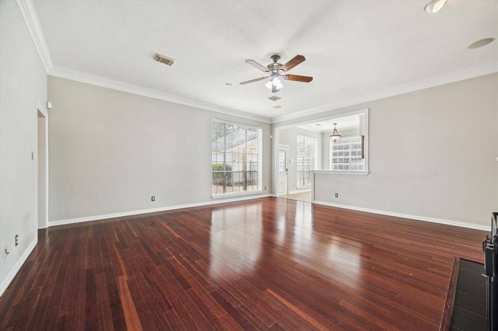 The spacious family room provides the ideal backdrop for relaxing or entertaining, with easy flow into the kitchen and breakfast area.