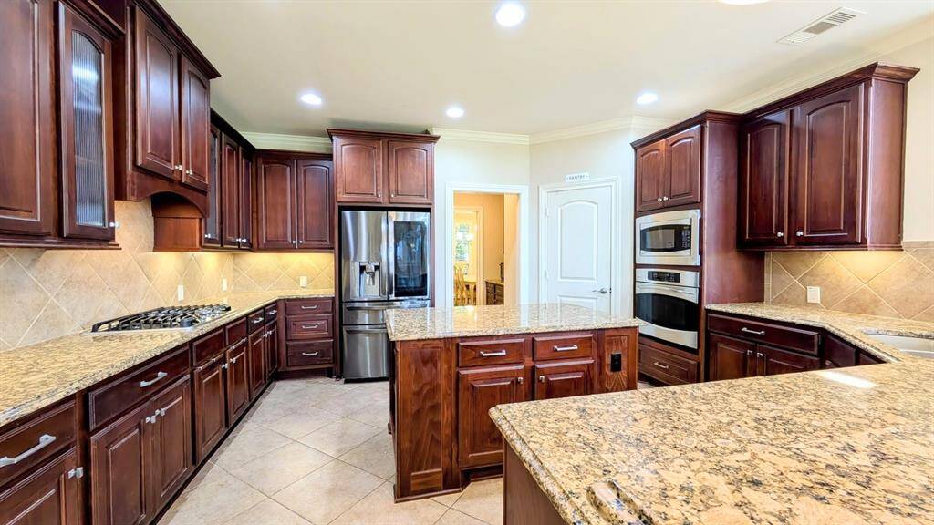 Large kitchen with granite counters