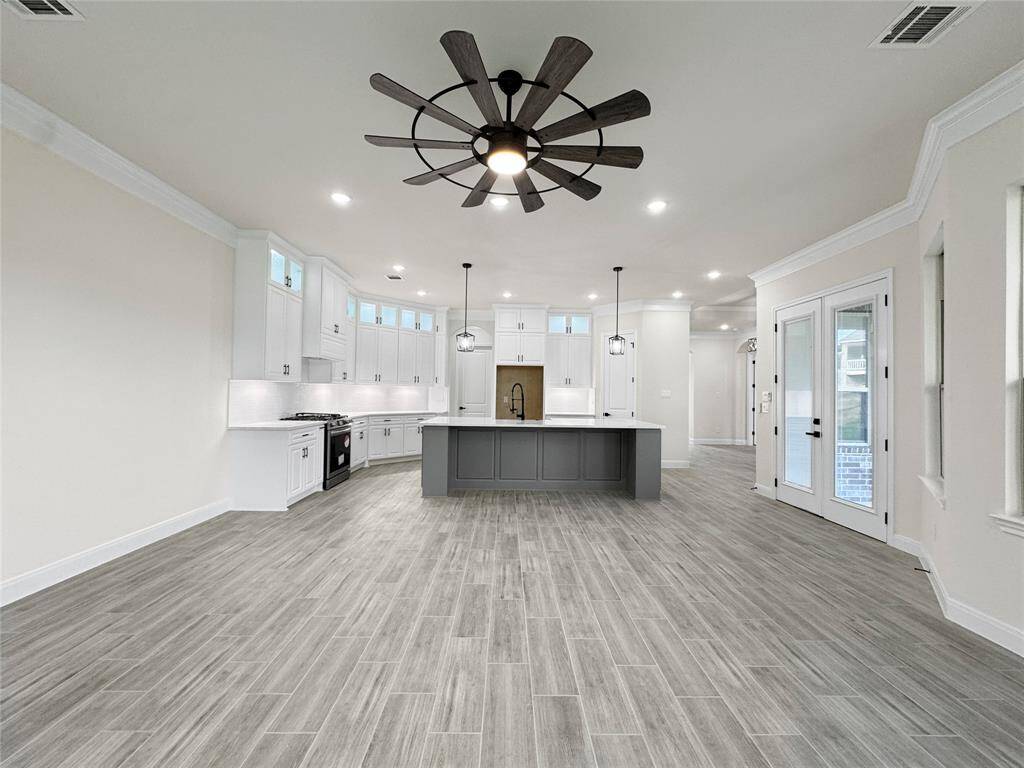 Similar Living Area Open to The Kitchen in a Home Built by TX Best Home Builders