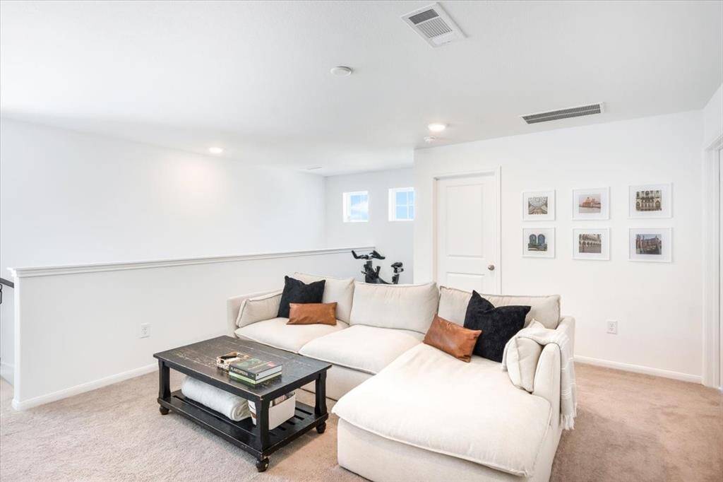 Upstairs gameroom is the perfect place to relax after a long day.  There is even a space for that piece of workout equipment that always seems to be in the way.