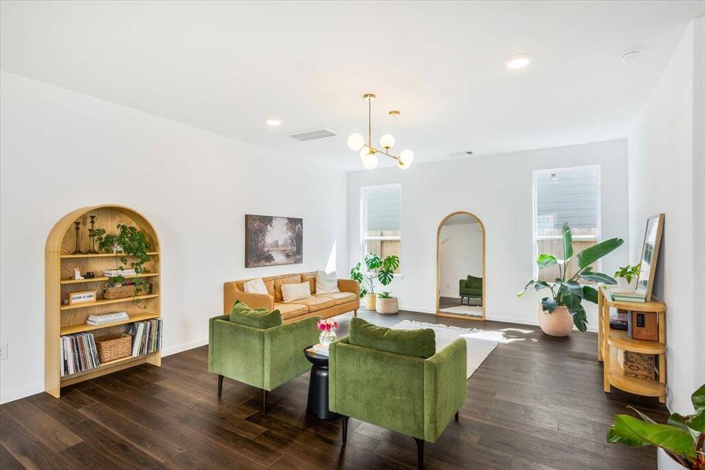 Living room is large and spacious and open to the kitchen and dining room.