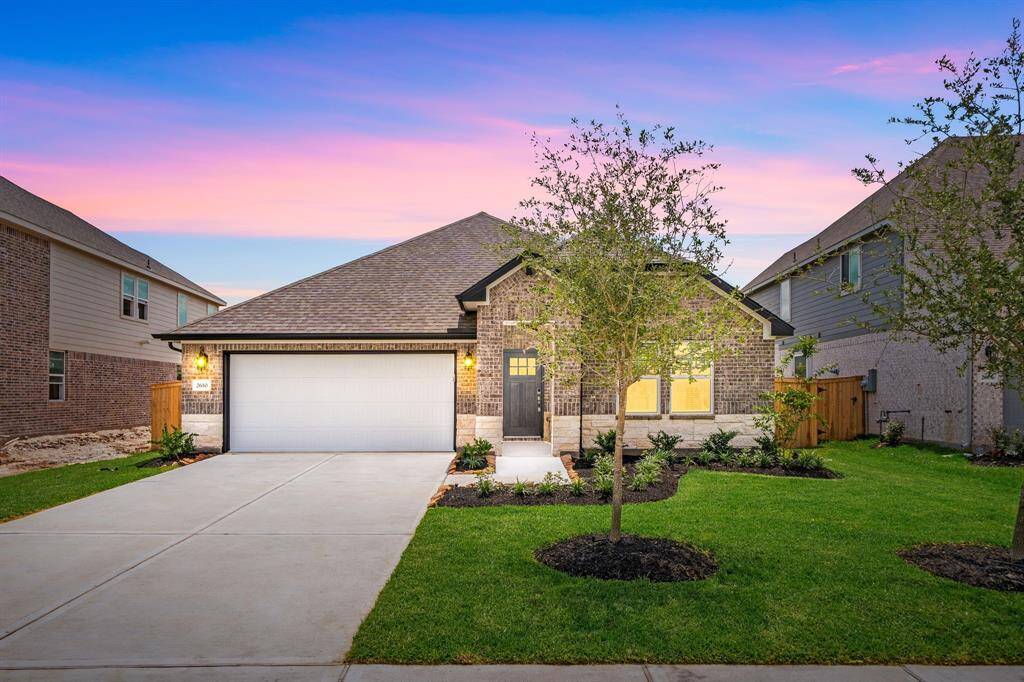 Welcome home to 2610 Clapbread Lane, a Meritage home, located on a quiet street in Kingdom Heights and zoned to Lamar Consolidated ISD! This stunning home has lovely curb appeal, a well-manicured lawn, beautiful landscaping, stone/brick elevation, dark stained front door with glass detailing, covered front porch, traditional style, beautiful outdoor lanterns and a double wide driveway!