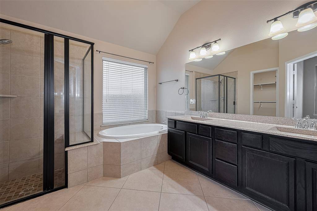 Primary Bathroom with double sinks walk-in shower an dlarge soaking tub