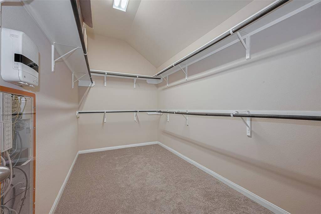 Walk-in closet in primary bedroom