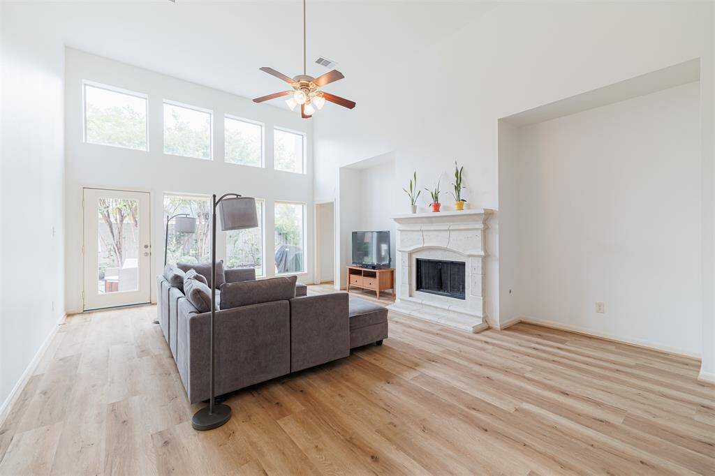 Bright and open family room with high ceilings and dual entertainment niches.
