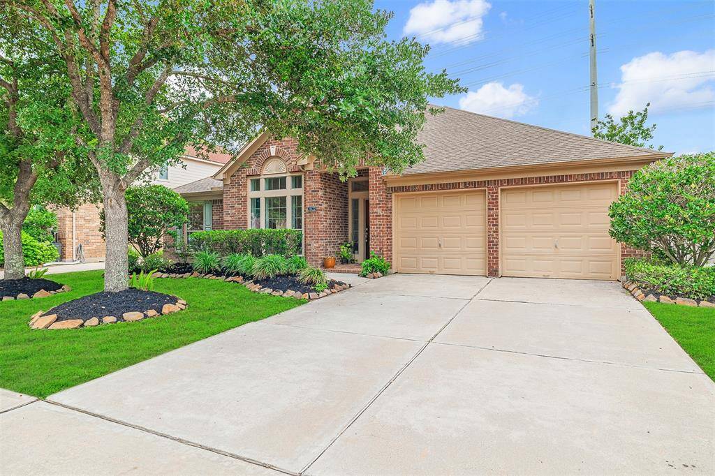 This home is beautifully landscaped and features a 2-car attached garage.