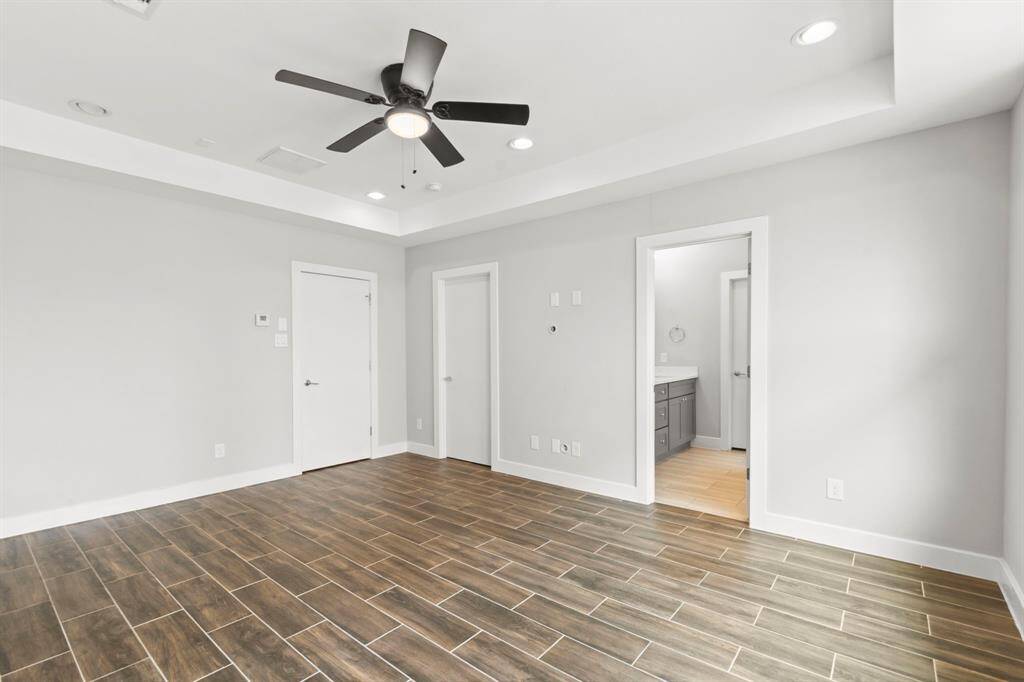 Third floor- Large primary bedroom with vaulted ceiling. Tile throughout 3rd floor.