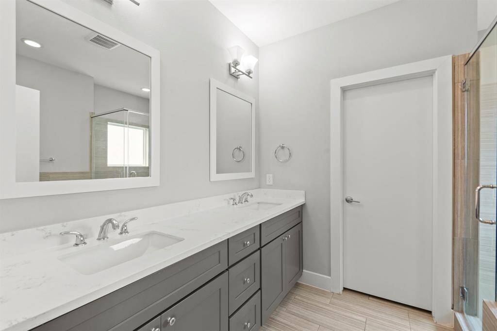 Primary bathroom with dual sinks.