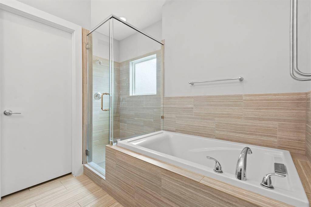 Large walk-in shower and soaking tub.