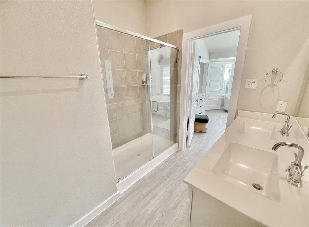 Beautiful tile and light grey vinyl plank flooring!