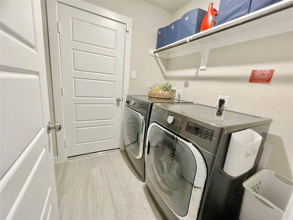 Another view of the laundry area on the way to the garage.